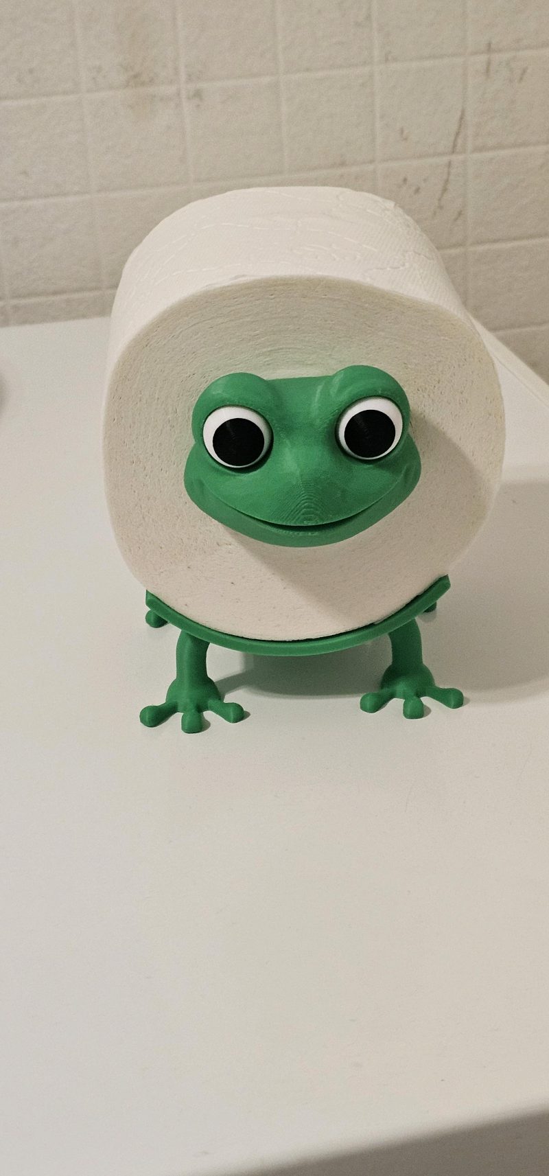 Dérouleur de papier toilette « grenouille » — s'adapte à tout