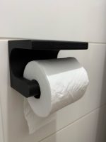 Dérouleur de papier toilette avec tablette