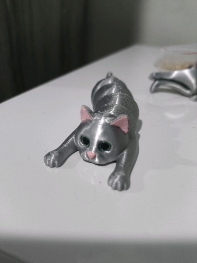 Chat articulé porte-objet — imprimé en place
