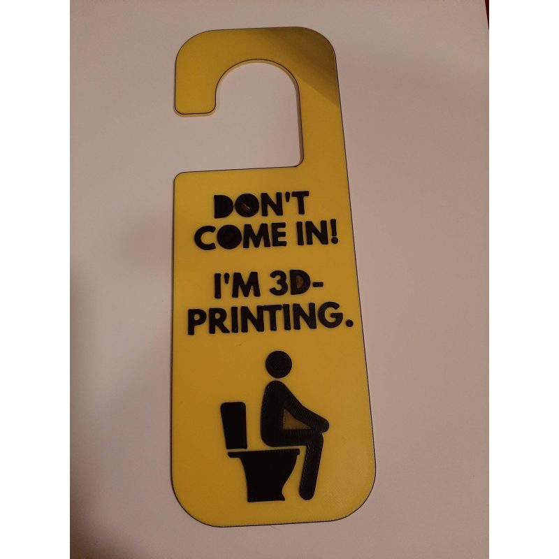 Plaque de porte pour toilettes — version qui fait sourire