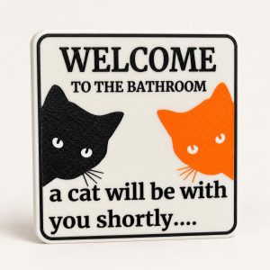 Plaque de toilettes « un chat va s'occuper de vous », imprimé en 3D par 3D'CLYPSE